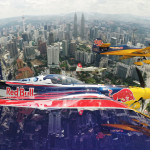 Kirby Chambliss of the United States flies in formation with Matt Hall of Australia, Yoshihide Muroya of Japan and Nigel Lamb of Great Britain