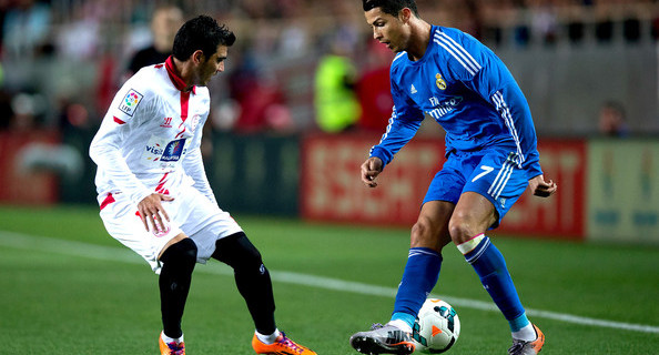 Sevilla’s Jose Antonio Reyes (L) fighting for the ball against Real Madrid’ Cristiano Ronaldo at the Ramon Sanchez Pizjuan Stadium on Mar 26, 2014. Sevilla won 2-1.